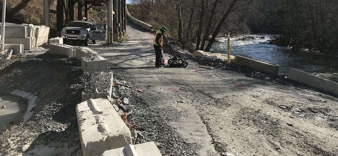 technician using GPR next Toe River in Spruce Pine, NC