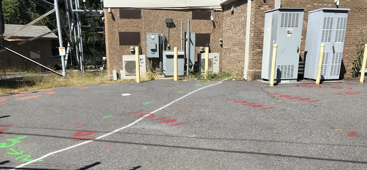 Utility marks at cell tower station.