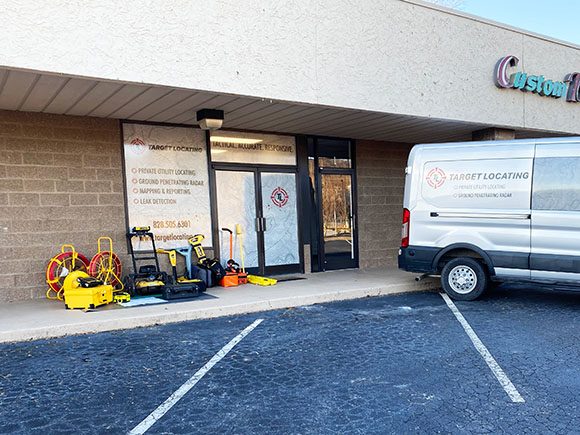 Target Locating storefront showing company van and locating equipment